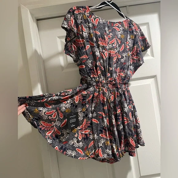 Adorable Dondi Navy Blue Print Romper perfect for your next vacation or summer - Picture 3 of 5